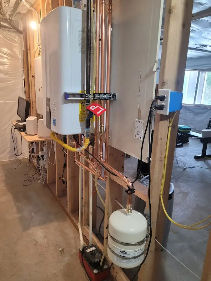 Licensed plumber repairing a kitchen sink in Harpswell